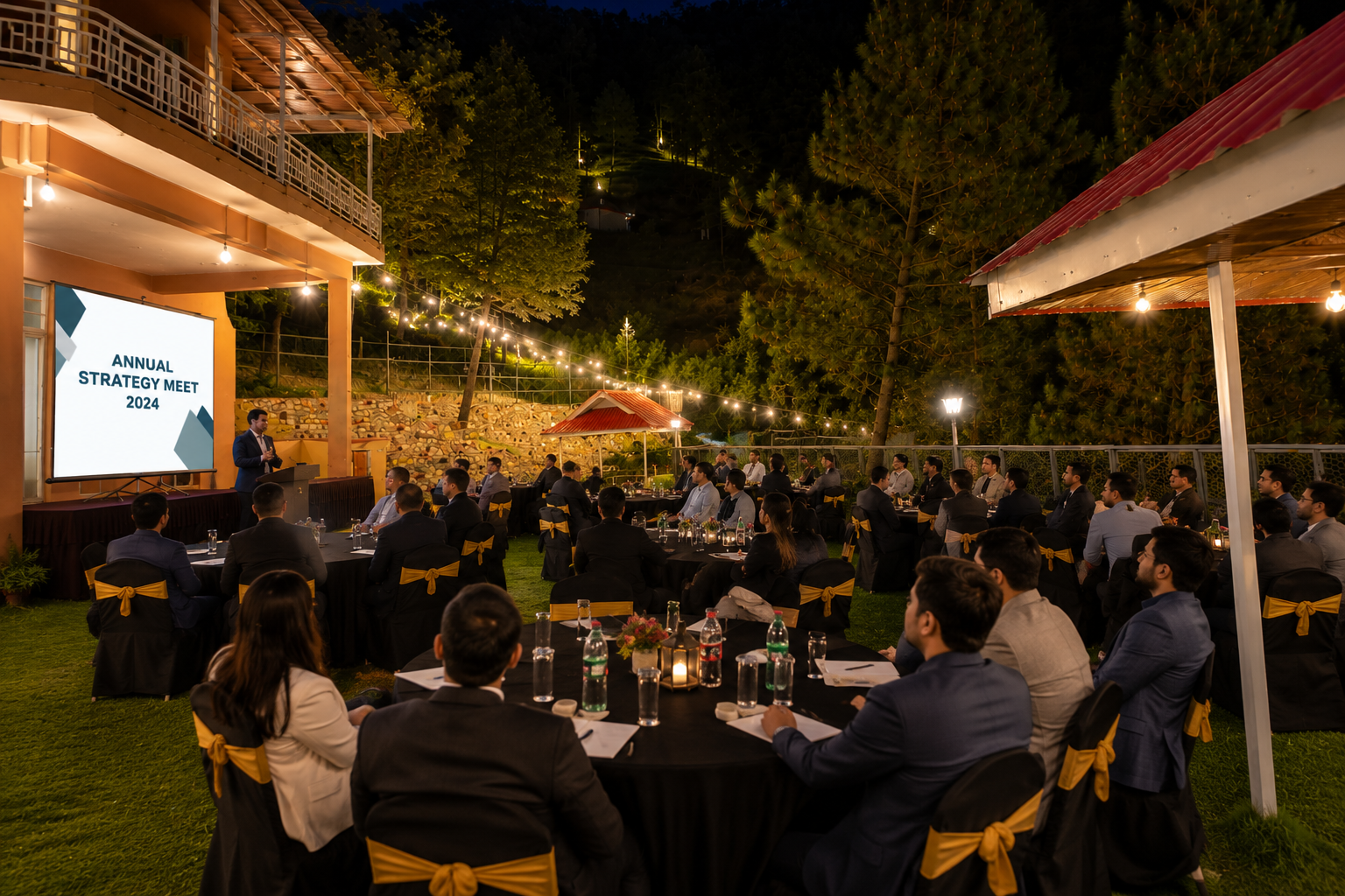 Corporate group attending an outdoor strategy dinner on the resort lawn