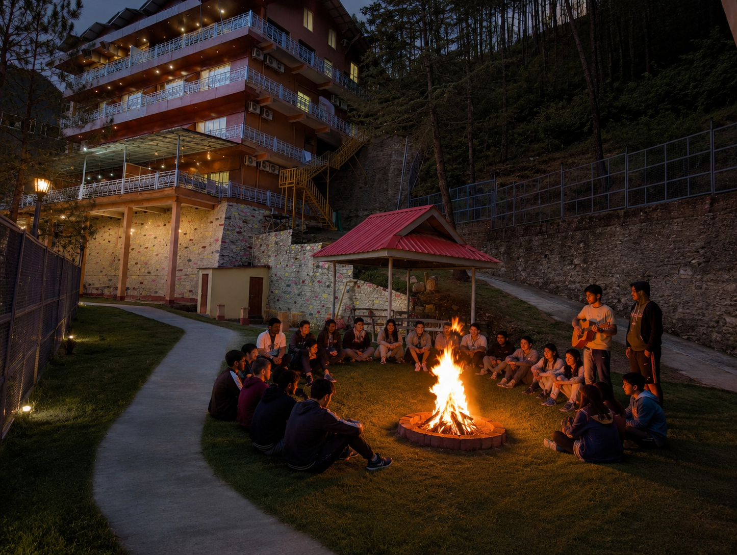 School students enjoying a bonfire evening at The Chail Pine Orchard Resort