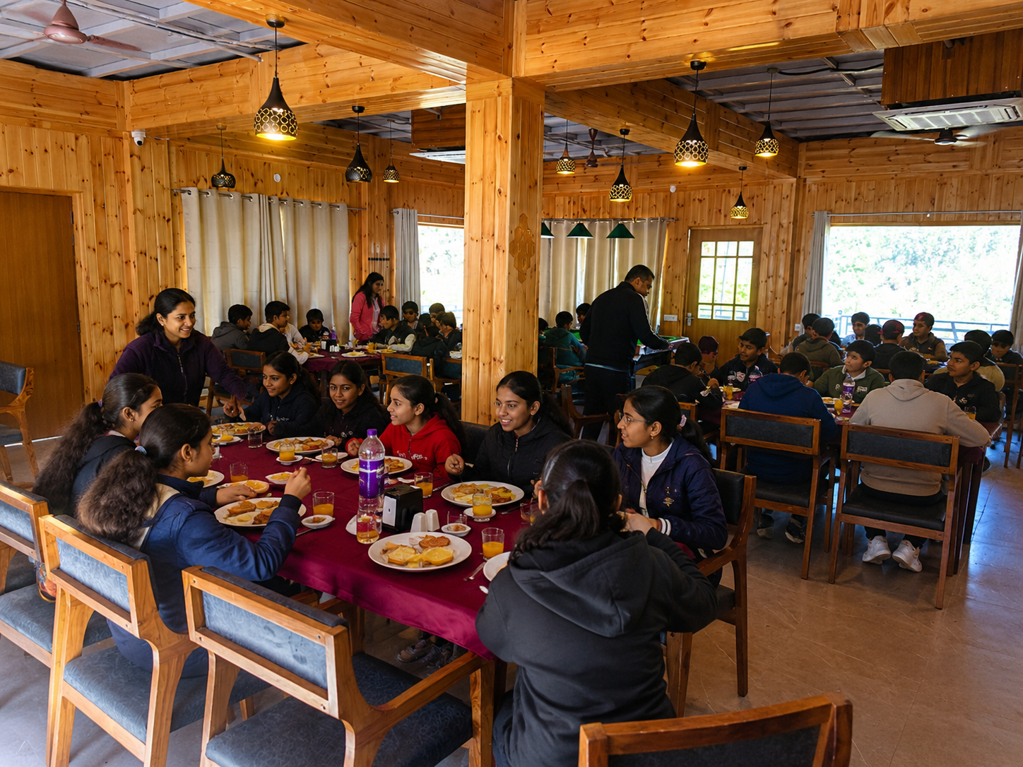 School students enjoying breakfast in the resort restaurant