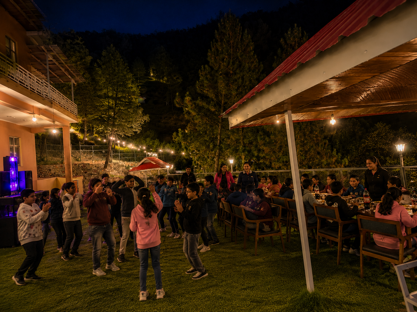 School students dancing during an evening party at the resort